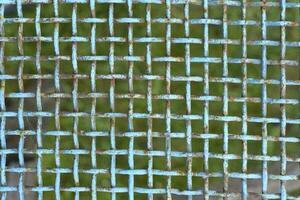 Iron painted mesh. Blue metal mesh close-up. iron fence. photo