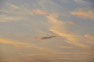 Sunset evening and red-blue clouds in the sky. Beautiful clouds in the evening. photo