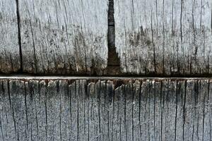 The surface of old rotten boards. Cracks in the wood. Old plywood. Traces of paint. photo