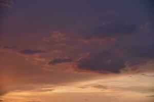 Pink clouds and evening sunset sky after a thunderstorm. Blue-red sunset evening. Beautiful pink clouds. photo