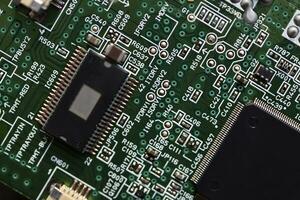 Blue board with radio elements. A chip with a processor and transistors. Diodes and resistors. Microchip. photo