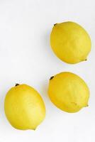 Yellow juicy lemons on a white background. Lemon close-up. photo