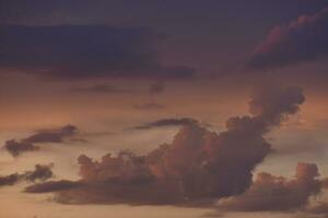 Pink clouds and evening sunset sky after a thunderstorm. Blue-red sunset evening. Beautiful pink clouds. photo