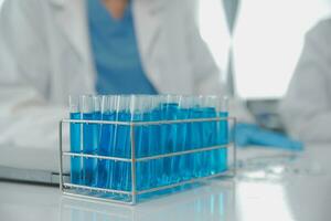 Team of Scientists Choose Between Printed Circuit Board to Work With. In The Background Technologically Advanced Scientific Research Center. photo