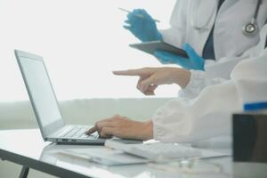 Team of Scientists Choose Between Printed Circuit Board to Work With. In The Background Technologically Advanced Scientific Research Center. photo