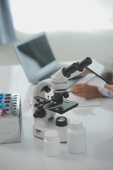 Team of Scientists Choose Between Printed Circuit Board to Work With. In The Background Technologically Advanced Scientific Research Center. photo