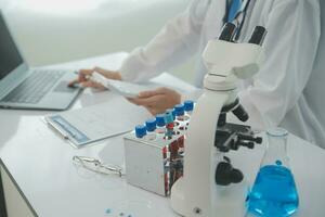 Team of Scientists Choose Between Printed Circuit Board to Work With. In The Background Technologically Advanced Scientific Research Center. photo