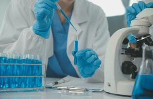 Team of Scientists Choose Between Printed Circuit Board to Work With. In The Background Technologically Advanced Scientific Research Center. photo