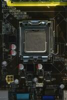 The processor of the computer on the motherboard. Electronic elements and a processor in a computer. photo