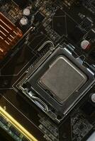 The processor of the computer on the motherboard. Electronic elements and a processor in a computer. photo