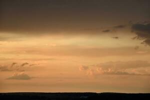 Pink clouds and evening sunset sky after a thunderstorm. Blue-red sunset evening. Beautiful pink clouds. photo