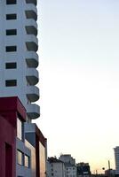 Beautiful high-rise panel residential building against the blue sky. A high-rise building in the city. A new house. photo