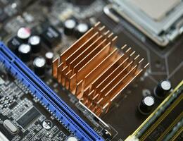 The processor of the computer on the motherboard. Electronic elements and a processor in a computer. photo