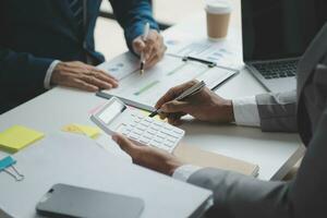 analyst or financial advisor provides advice on securities analysis and stock market management. Businessman showing documents through graphs and charts. Brainstorm and work together photo