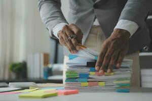 analyst or financial advisor provides advice on securities analysis and stock market management. Businessman showing documents through graphs and charts. Brainstorm and work together photo