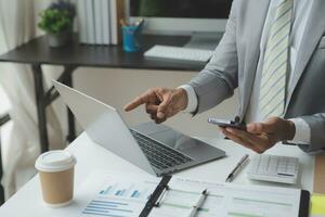 analyst or financial advisor provides advice on securities analysis and stock market management. Businessman showing documents through graphs and charts. Brainstorm and work together photo