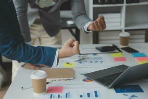 analyst or financial advisor provides advice on securities analysis and stock market management. Businessman showing documents through graphs and charts. Brainstorm and work together photo