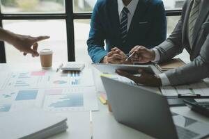 analyst or financial advisor provides advice on securities analysis and stock market management. Businessman showing documents through graphs and charts. Brainstorm and work together photo