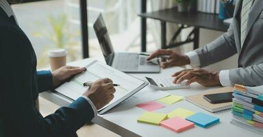 analyst or financial advisor provides advice on securities analysis and stock market management. Businessman showing documents through graphs and charts. Brainstorm and work together photo