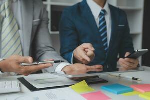 analyst or financial advisor provides advice on securities analysis and stock market management. Businessman showing documents through graphs and charts. Brainstorm and work together photo