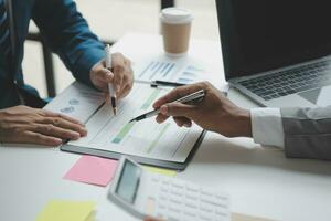 analyst or financial advisor provides advice on securities analysis and stock market management. Businessman showing documents through graphs and charts. Brainstorm and work together photo