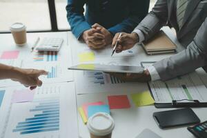 analyst or financial advisor provides advice on securities analysis and stock market management. Businessman showing documents through graphs and charts. Brainstorm and work together photo