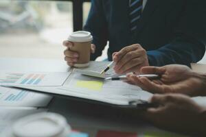 analyst or financial advisor provides advice on securities analysis and stock market management. Businessman showing documents through graphs and charts. Brainstorm and work together photo
