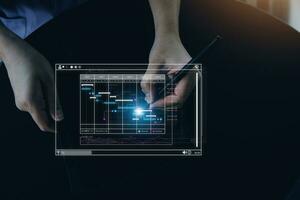 Analyst working with computer in Business Analytics and Data Management System to make report with KPI and metrics connected to database. Corporate strategy for finance, operations, sales, marketing. photo