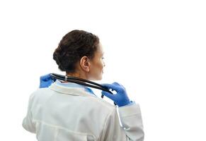 Confident doctor with stethoscope on his neck isolated on white background. View from the back. Copy space photo