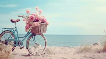 Bicycle with a basket sits on top of sand near the ocean photo