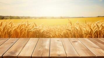 Wooden table with wheat field background photo