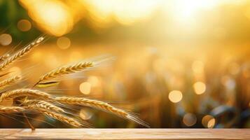 Wooden table with wheat field background photo