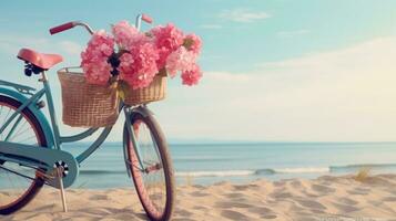 Bicycle with a basket sits on top of sand near the ocean photo