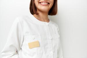 Soft focus on blank badge with space for text on white doctor's coat with beautiful smile photo