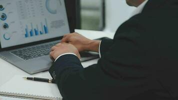 Financial analysts analyze business financial reports on a digital tablet planning investment project during a discussion at a meeting of corporate showing the results of their successful teamwork. video