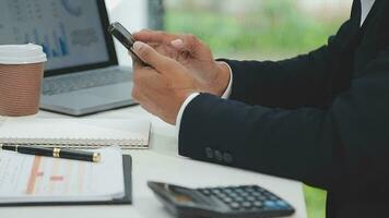 Financial analysts analyze business financial reports on a digital tablet planning investment project during a discussion at a meeting of corporate showing the results of their successful teamwork. video