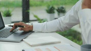 Financial analysts analyze business financial reports on a digital tablet planning investment project during a discussion at a meeting of corporate showing the results of their successful teamwork. video
