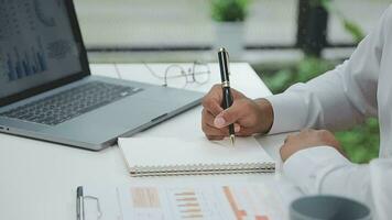 Financial analysts analyze business financial reports on a digital tablet planning investment project during a discussion at a meeting of corporate showing the results of their successful teamwork. video