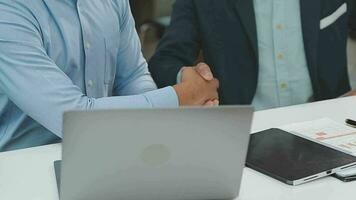 Financial analysts analyze business financial reports on a digital tablet planning investment project during a discussion at a meeting of corporate showing the results of their successful teamwork. video