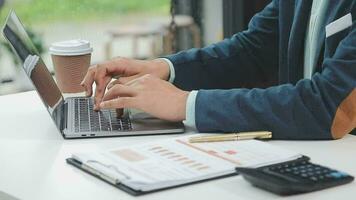 Financial analysts analyze business financial reports on a digital tablet planning investment project during a discussion at a meeting of corporate showing the results of their successful teamwork. video
