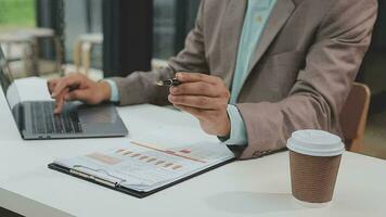 Financial analysts analyze business financial reports on a digital tablet planning investment project during a discussion at a meeting of corporate showing the results of their successful teamwork. video