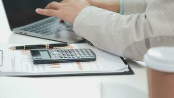Financial analysts analyze business financial reports on a digital tablet planning investment project during a discussion at a meeting of corporate showing the results of their successful teamwork. video