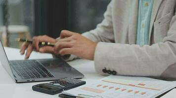 Financial analysts analyze business financial reports on a digital tablet planning investment project during a discussion at a meeting of corporate showing the results of their successful teamwork. video