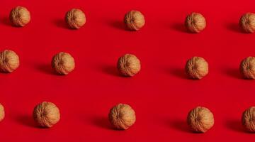 Walnut pattern on red background with space for text photo