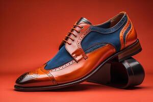 Men's shoes on a red background. Studio shot. Side view. photo