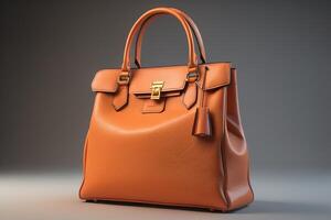 Luxury leather bag on a gray background. photo