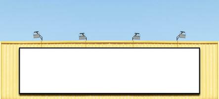 Mock up white background billboard on yellow building with spot light photo