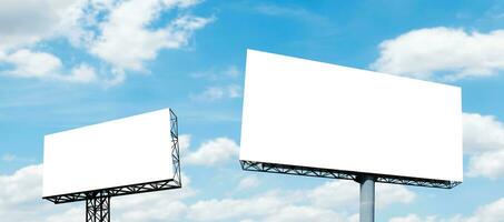 Two pole outdoor billboard with blue sky background photo