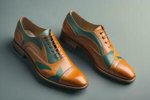 Pair of brown leather shoes on grey background, studio shot. photo