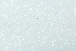 White glitter abstract background texture. Full frame. Selective focus photo